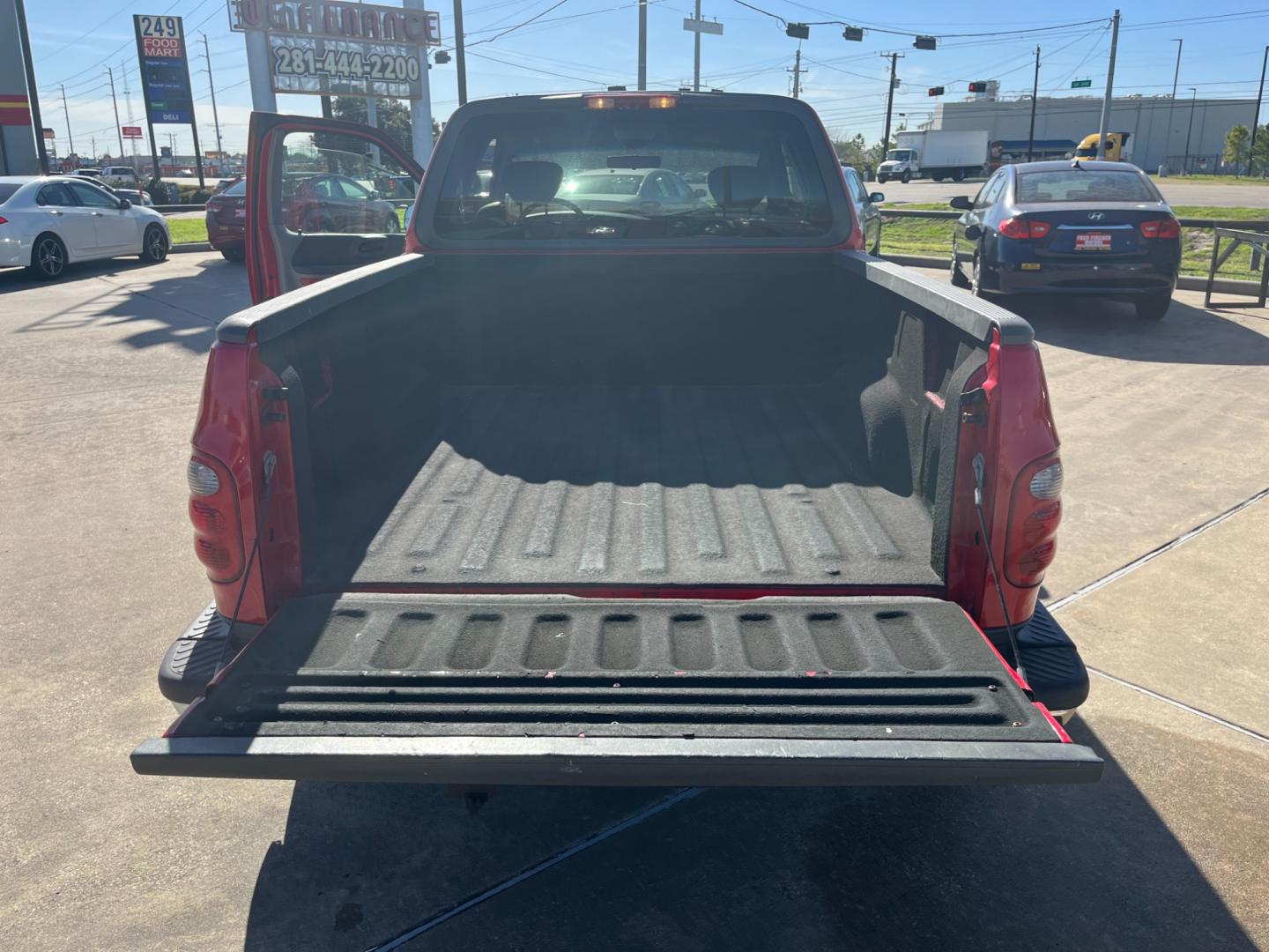 2003 red /TAN Ford F-150 XL SuperCab Flareside 2WD (1FTRX07213K) with an 4.2L V6 OHV 12V engine, Automatic transmission, located at 14700 Tomball Parkway 249, Houston, TX, 77086, (281) 444-2200, 29.928619, -95.504074 - Photo#13